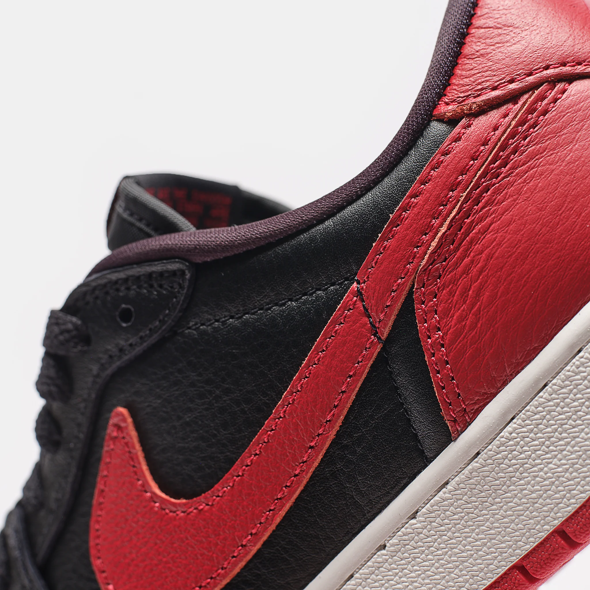 Air Jordan 1 Retro Low OG Big Kids Sneaker in Black/Black/Varsity Red/Summit White - Image 6